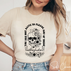 Floral Skull Empowerment Tee – Bella + Canvas 3001 | “You’re Not Alive to Please These Motherf*ckers”  Bella Canvas Shirt 🌸💀🔥